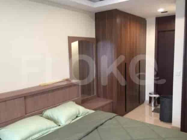 The bedroom features a king-size bed, a large closet, and a mirror.