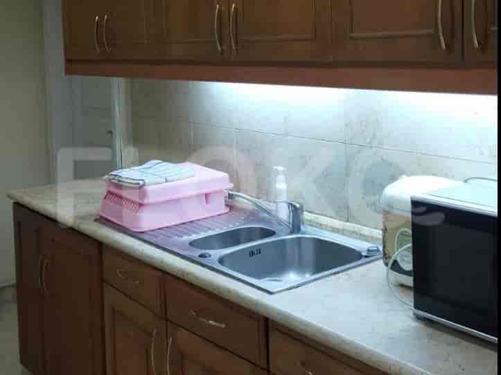 A kitchen with cabinets, a sink, and appliances.