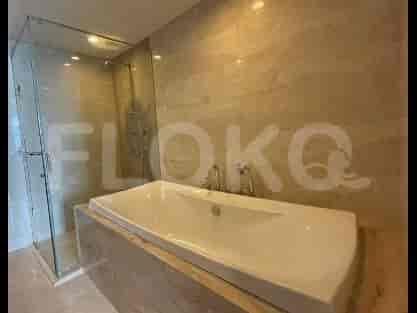 A luxurious bathroom with a freestanding bathtub and a glass-enclosed shower.