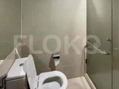 A bathroom showing a toilet and shower.