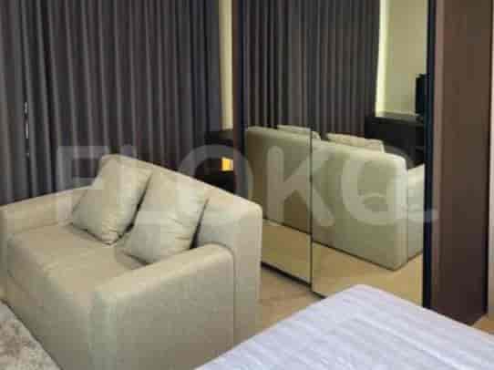 Living room with sofa, curtains, and a large mirror.