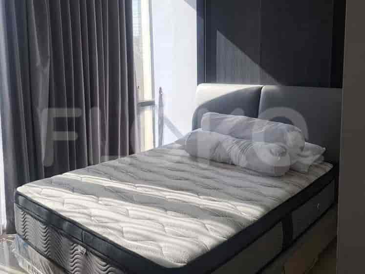 Another angle of the bedroom, with a focus on the bed.