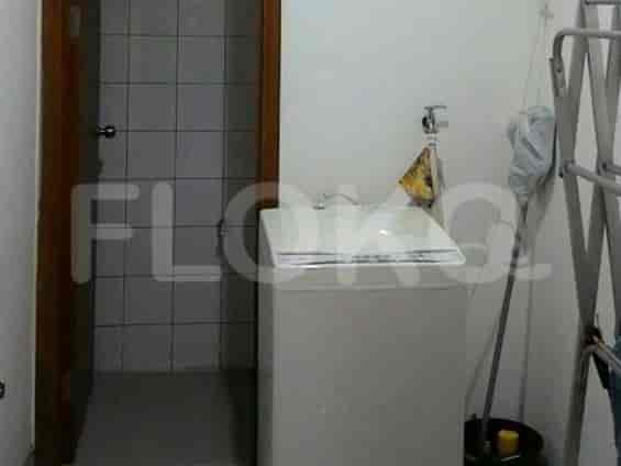 A laundry area with a washing machine.