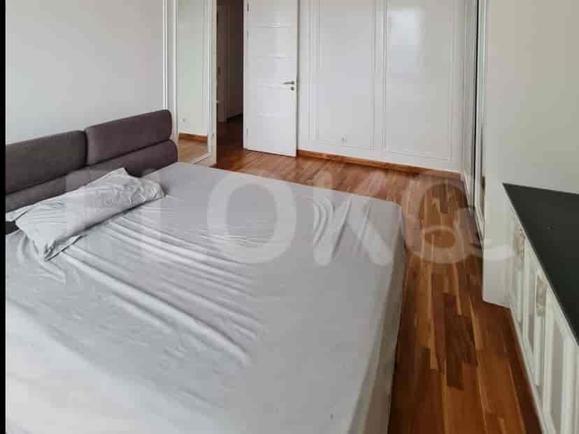 Bedroom with a bed and a white closet.