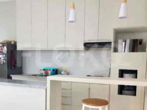 A modern kitchen with white cabinetry, a breakfast bar, and pendant lighting.