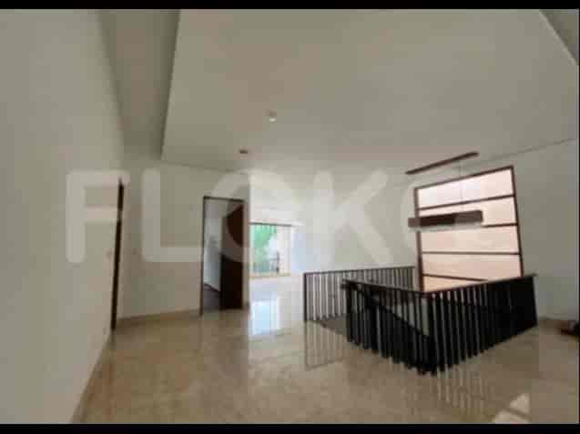 A corridor or open area with marble flooring, a staircase, and views to an outdoor area through a window.