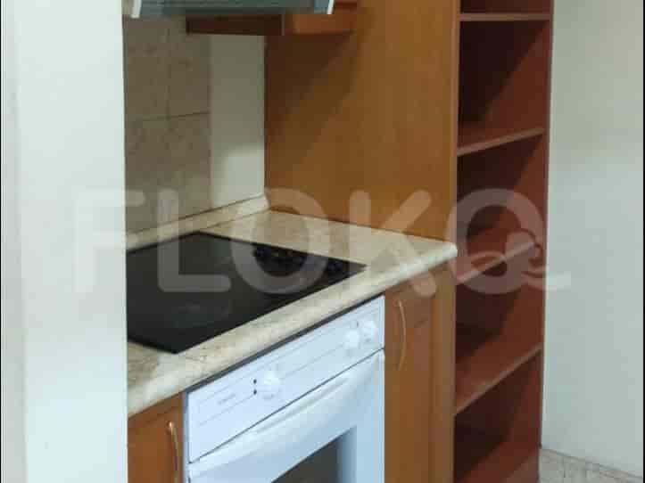 A kitchen with cabinets, and appliances.
