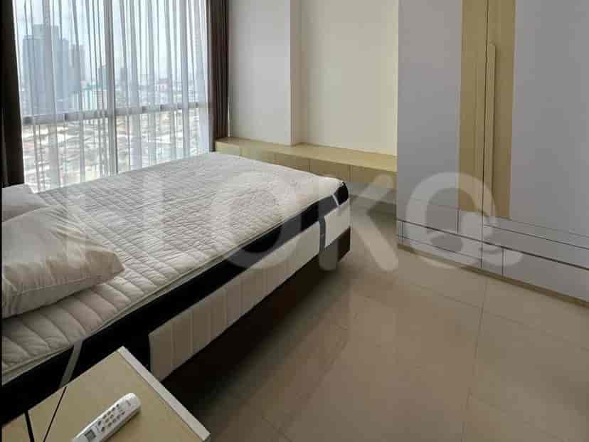 Spacious bedroom showing the bed and a wardrobe.