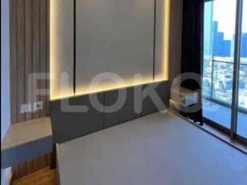 Bedroom showing bed, floating bedside tables with lighting.