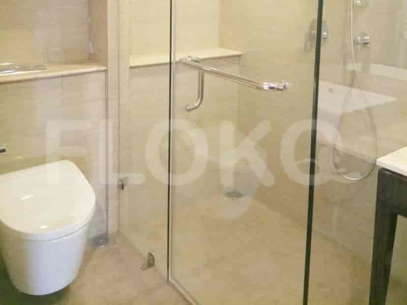 A modern shower stall with glass door.
