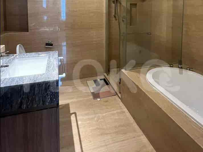 A bathroom with a bathtub, shower, and modern design.