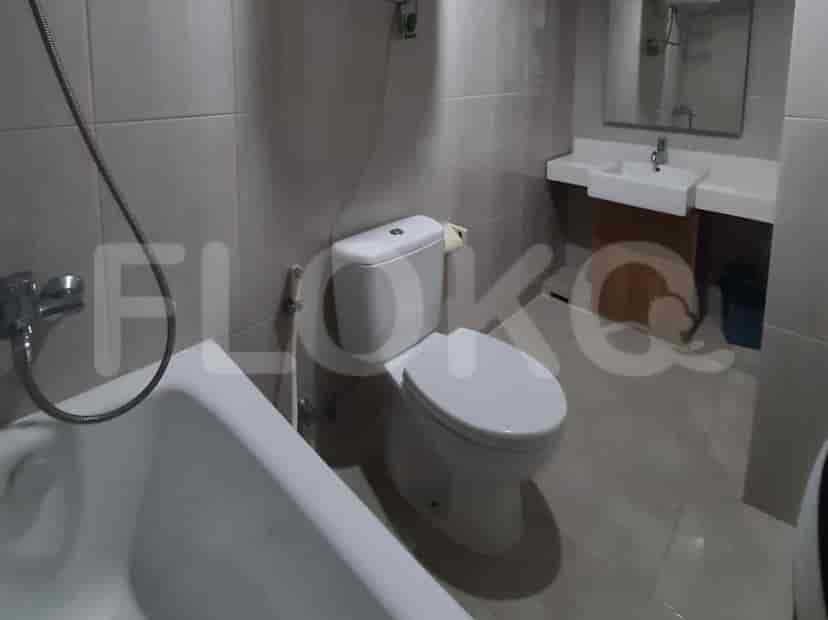 A bathroom featuring a bathtub, toilet, sink, and mirror.