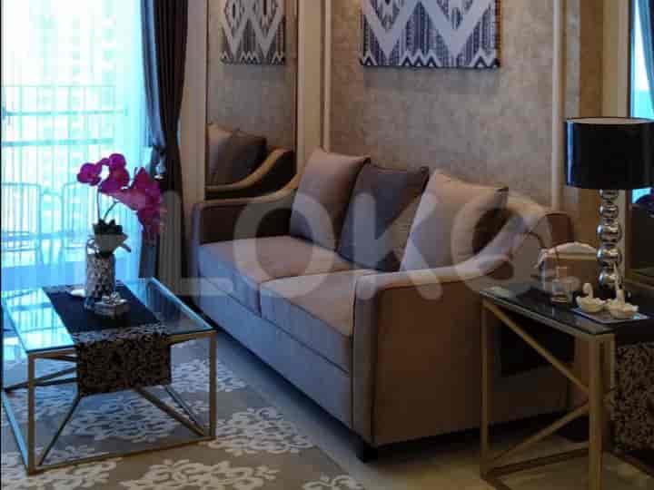 Living room with a sofa, coffee table, and decor.
