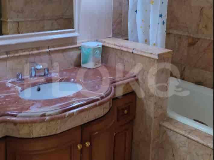 Bathroom with a vanity, sink, and bathtub.