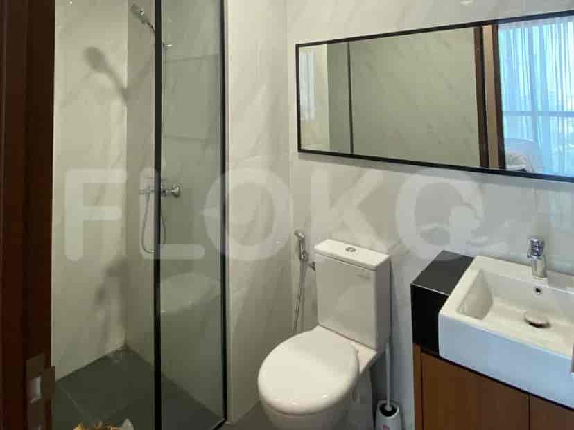 Contemporary bathroom with a shower, toilet, and sink.