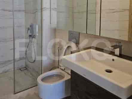 A modern bathroom with a shower and toilet.