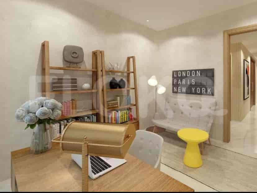 A home office setup with a wooden desk, bookshelves, and a cozy seating area.