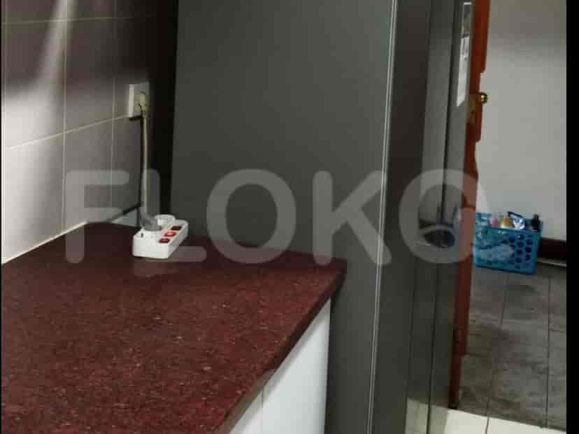 Kitchen with a counter and a fridge.