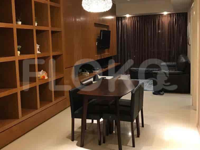 Living room with dining table, chairs, and entertainment unit.