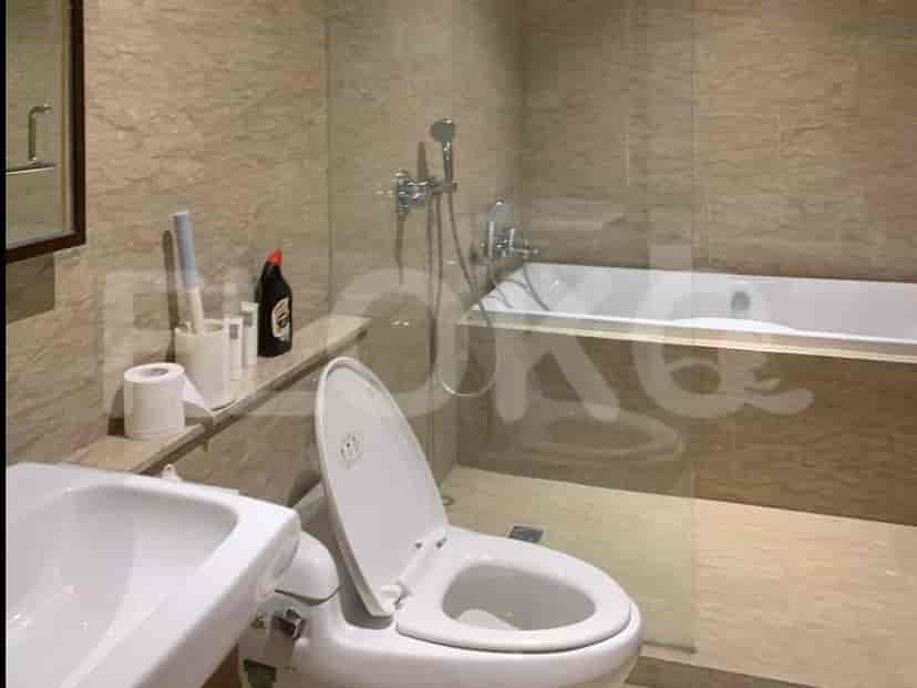 Luxurious bathroom with a bathtub, toilet, and shower