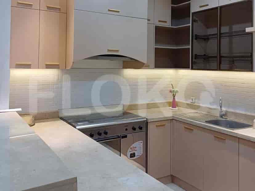 A modern kitchen with cabinetry, a stove, and a sink.