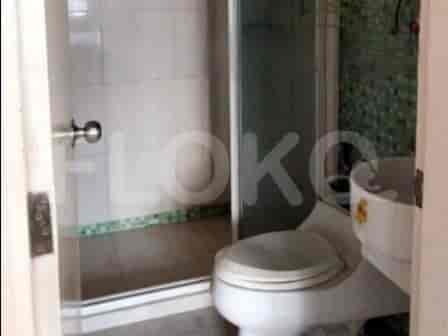 Clean bathroom with a glass shower, toilet, and sink.