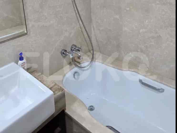A modern bathroom with a bathtub, a sink, and elegant design.