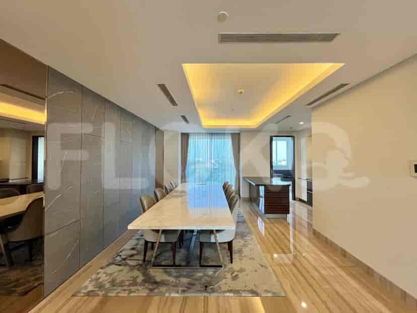 Elegant dining area with a marble dining table and seating for eight.