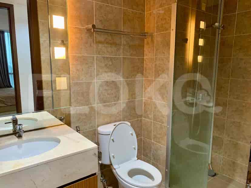 A bathroom with a toilet and sink.