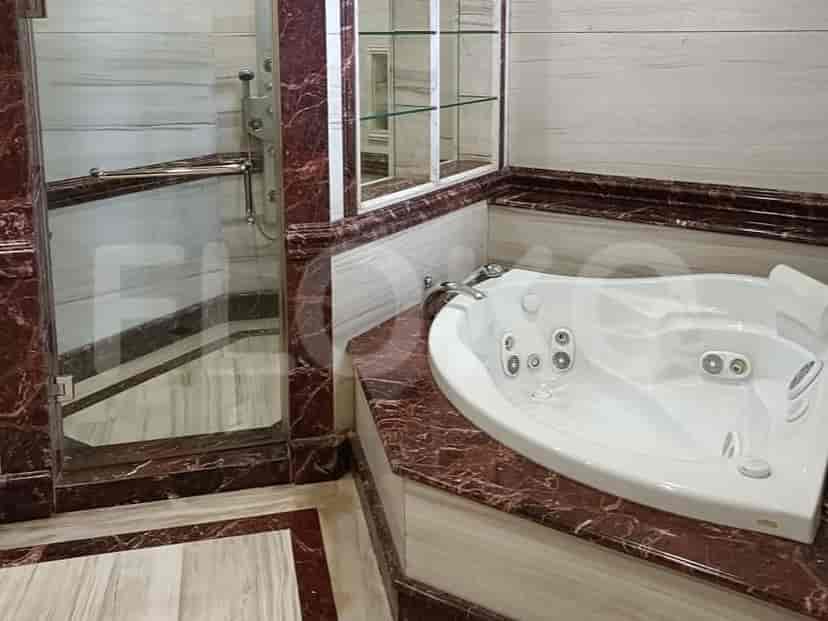 A staircase with glass windows and an ornate railing.