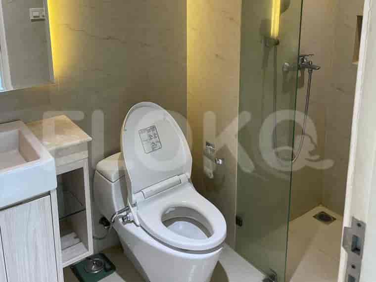Bathroom with a toilet, shower, and vanity.