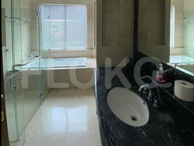 A luxurious bathroom with a bathtub, sink, and shower.