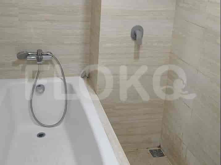 A bathroom featuring a bathtub and a shower area.