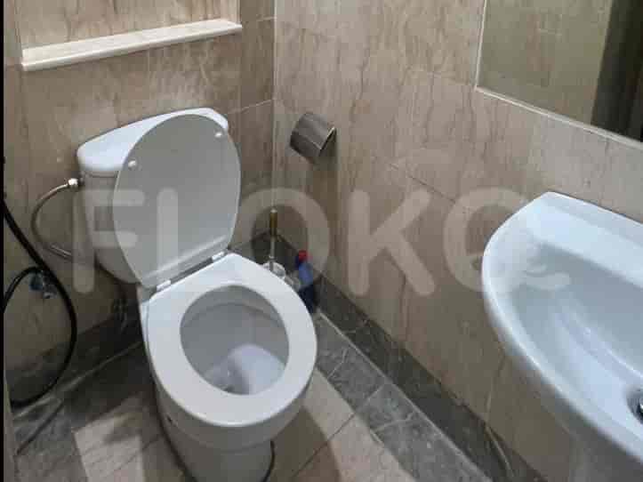 A well-maintained bathroom with a toilet and sink.