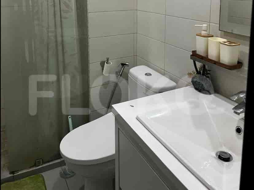 Bathroom with toilet and sink.