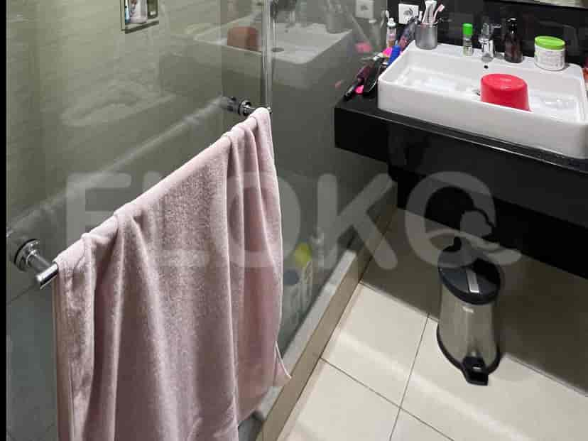 A bathroom with a sink and shower.