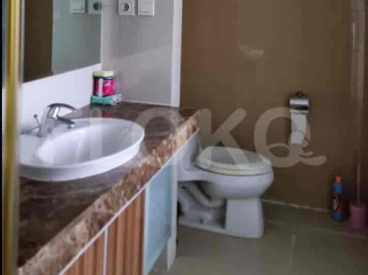 Bathroom with a white sink and a toilet.