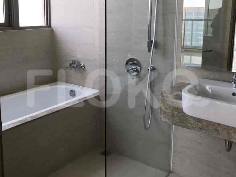 The bathroom has a tub, a shower, and a sink.