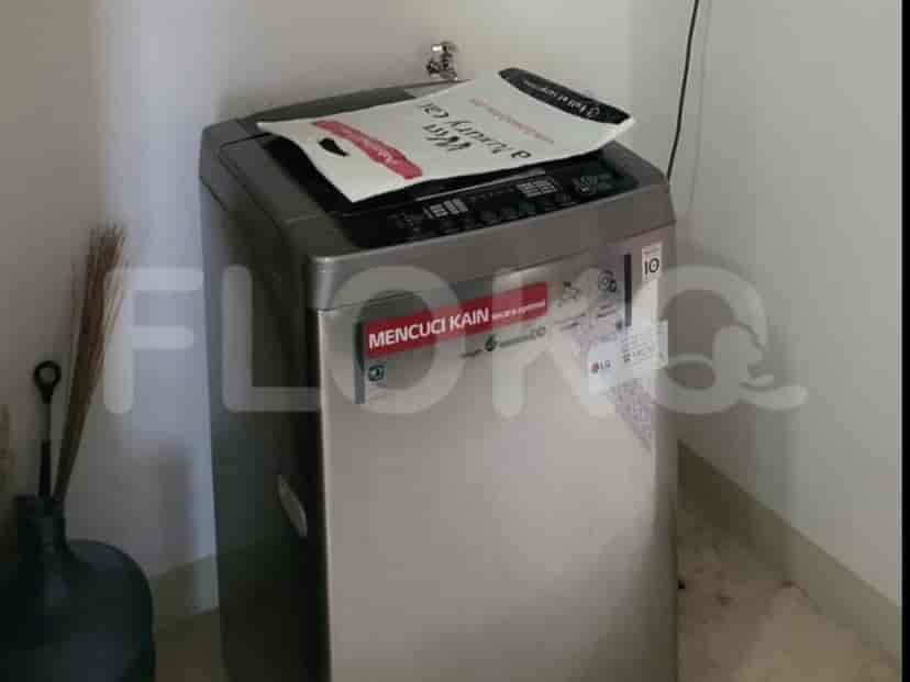 Laundry room with a washing machine.