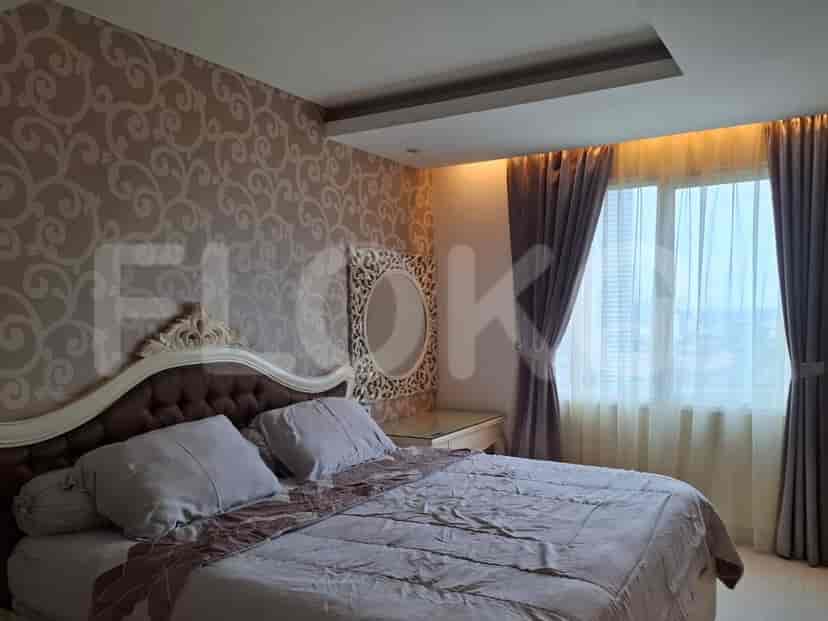A bedroom showcasing a bed, dressing table, and window.