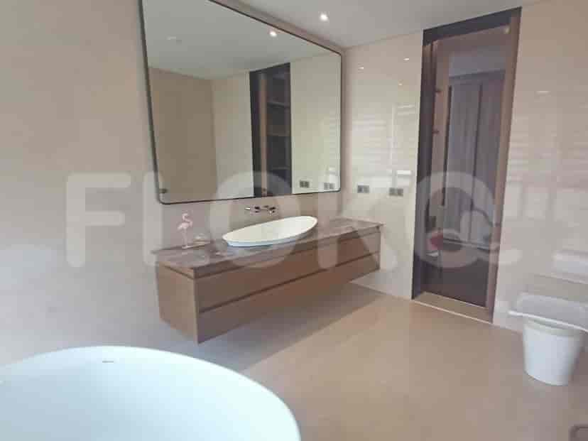A luxurious bathroom with a freestanding bathtub, vanity, and large mirror.