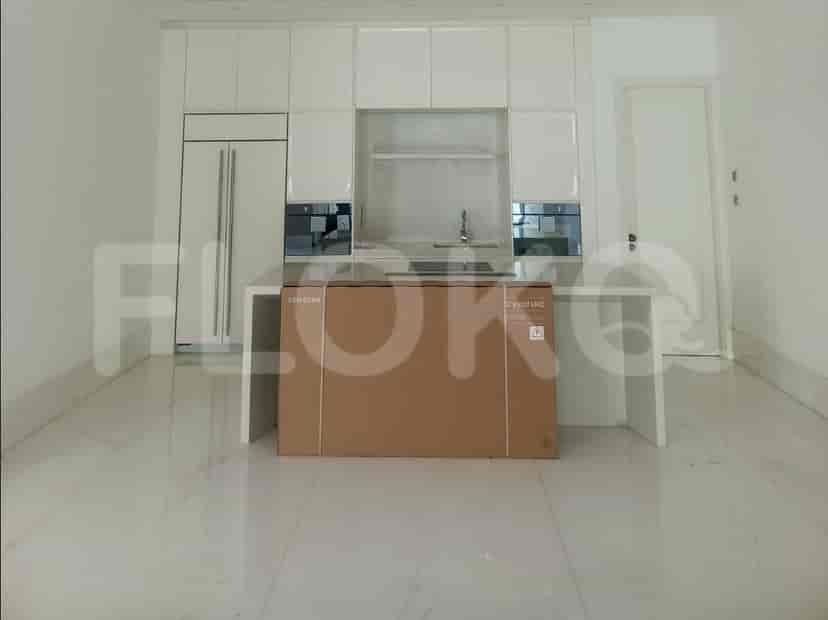 A contemporary kitchen with white glossy cabinets, a central island with a countertop, and modern appliances.