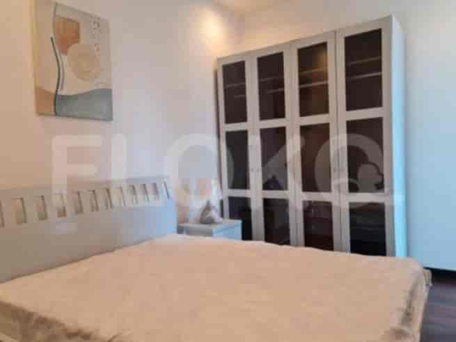 A bedroom showcasing a double bed and a mirrored wardrobe.