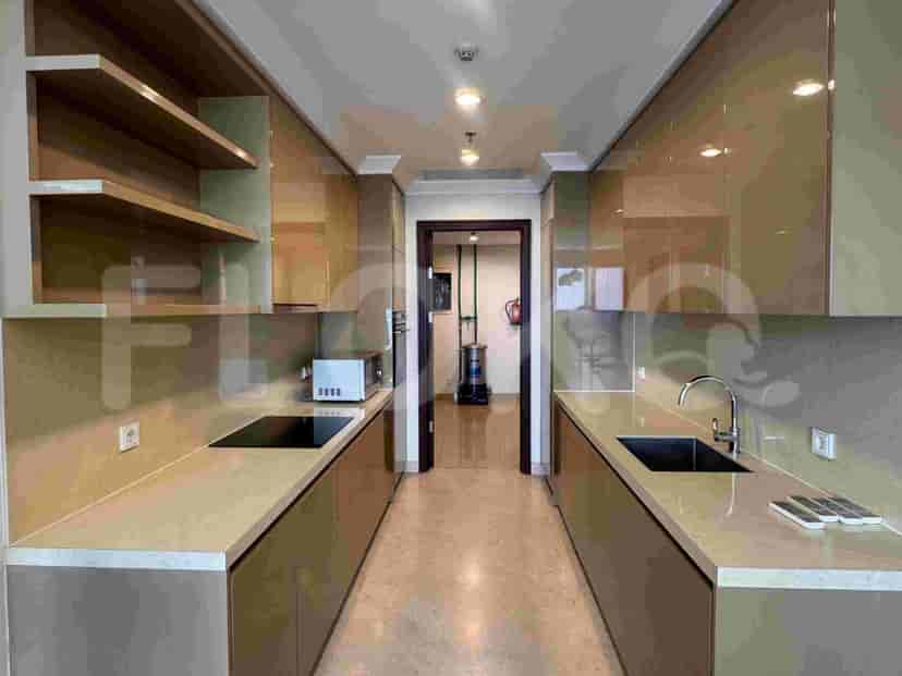 A modern, galley-style kitchen with ample cabinet space and stainless steel appliances.