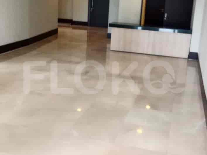 Hallway with marble flooring and wooden paneling