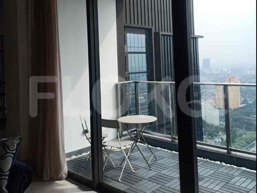 A balcony with a view of the city.