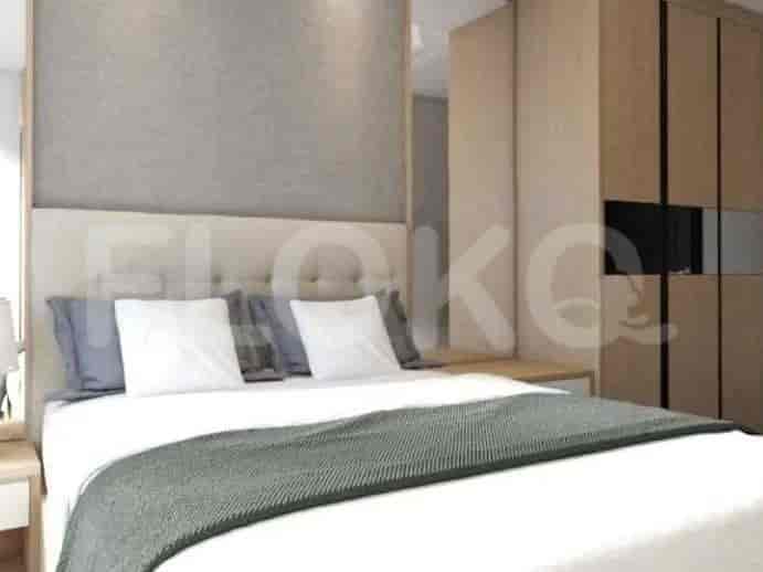 A bedroom with a bed, headboard, and wardrobe.