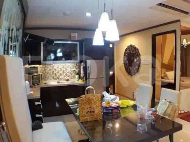 Kitchen and dining area with cabinets, appliances, and dining set.