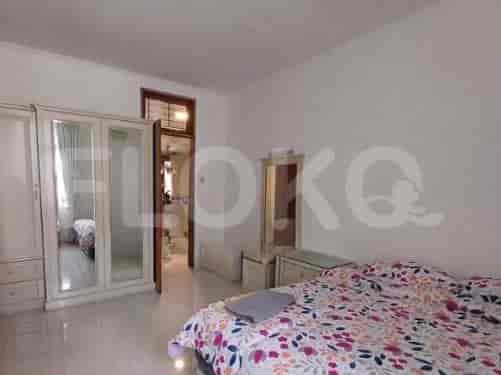 A bedroom with a bed, wardrobe, and ensuite bathroom.