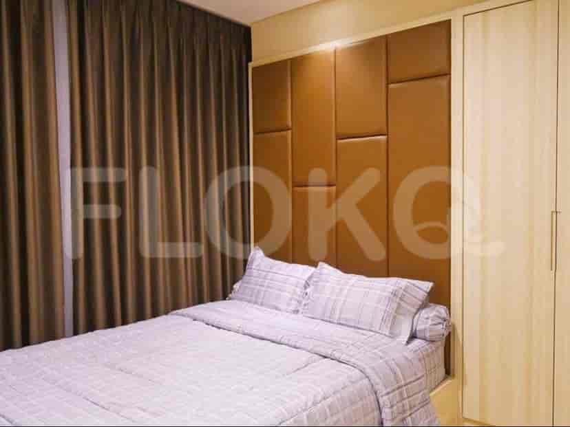 Bedroom with a bed and a wardrobe.